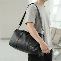 Sac de voyage homme en simili cuir, porté en bandoulière