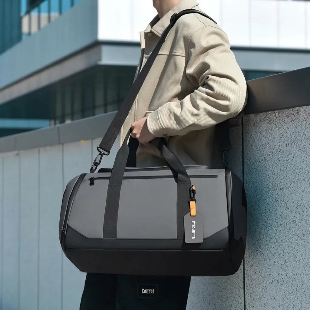 Sac de voyage homme multifonction, coloris gris, porté